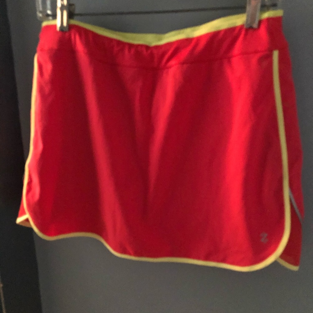 Running or golf skort orange with yellow piping